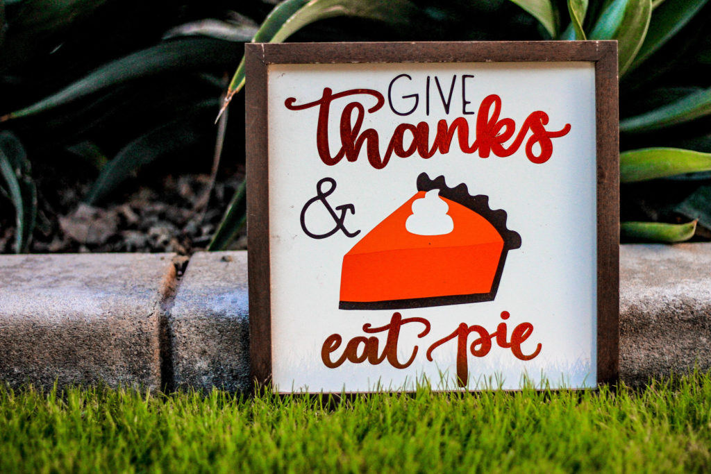 Picture of a poster with a piece of pumpkin pie that says Give Thanks Eat Pie
